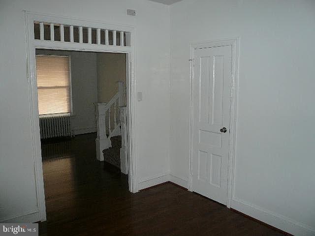 hall featuring dark hardwood / wood-style floors