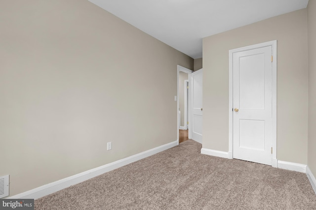 unfurnished bedroom with carpet flooring