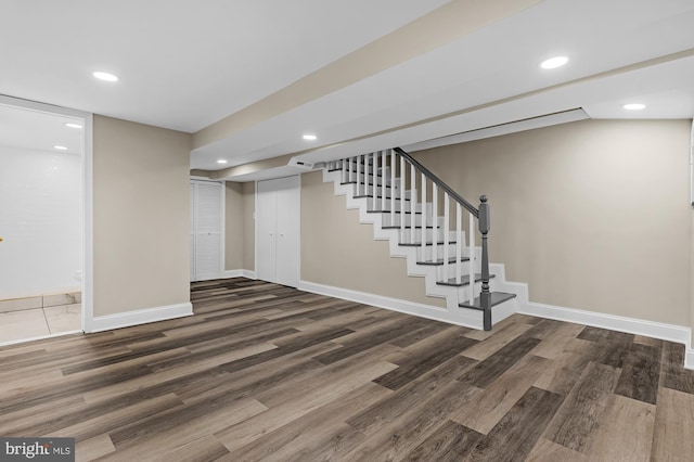 basement with dark wood-type flooring