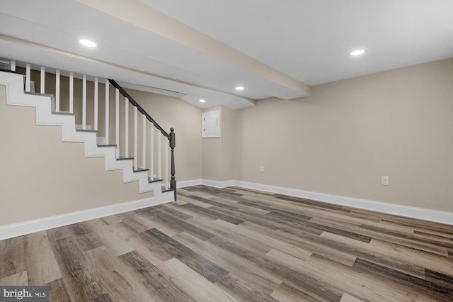 basement featuring hardwood / wood-style flooring