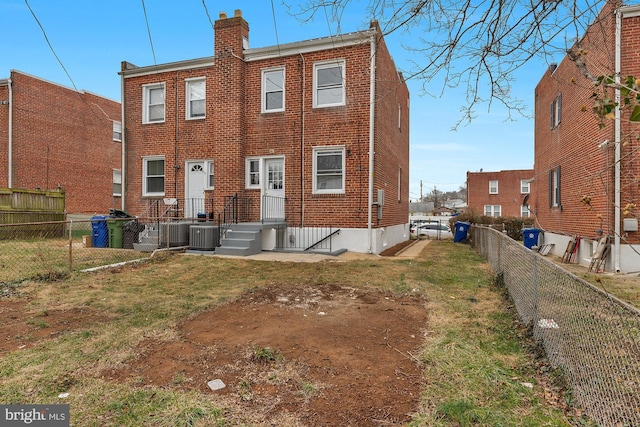 back of house featuring cooling unit