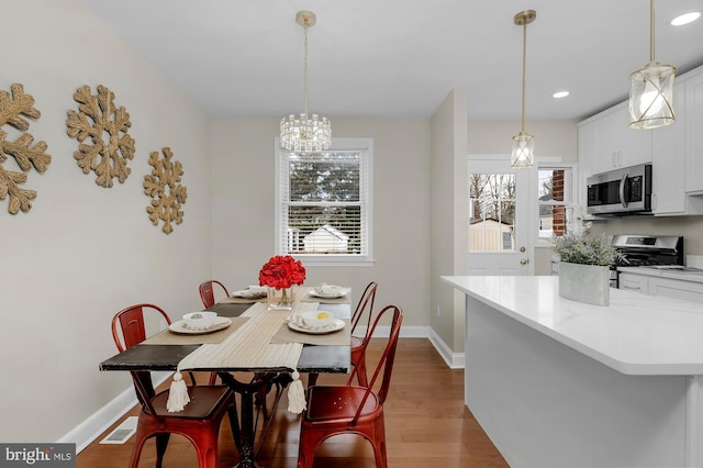 dining room featuring light wood-type flooring