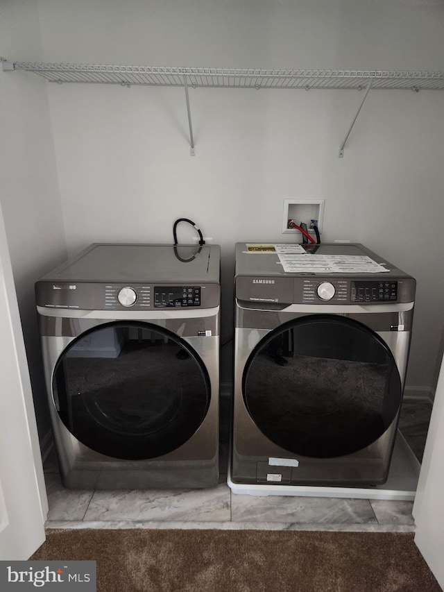 laundry room featuring washing machine and dryer