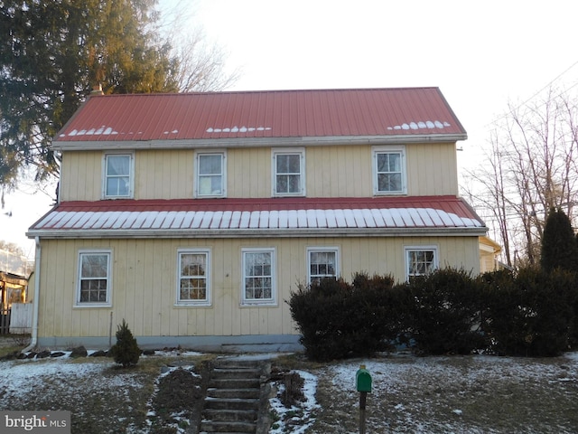 rear view of house with metal roof