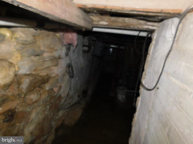 basement featuring concrete block wall