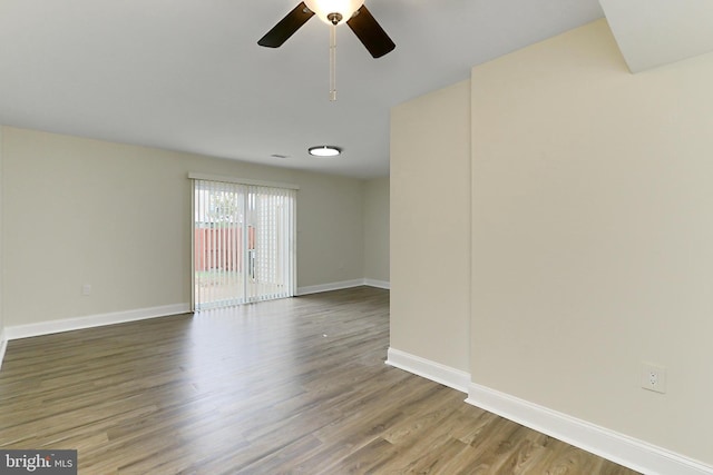 unfurnished room featuring ceiling fan and hardwood / wood-style floors