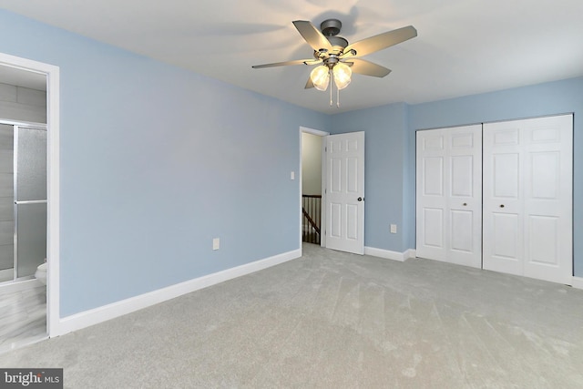 unfurnished bedroom featuring ceiling fan, a closet, and light carpet