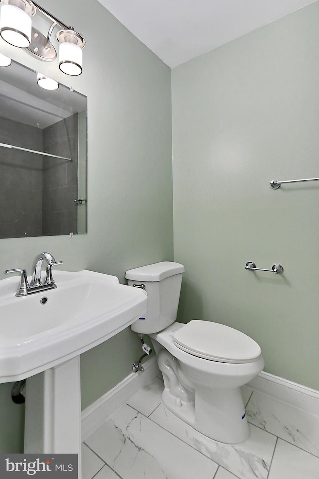 bathroom with sink and toilet