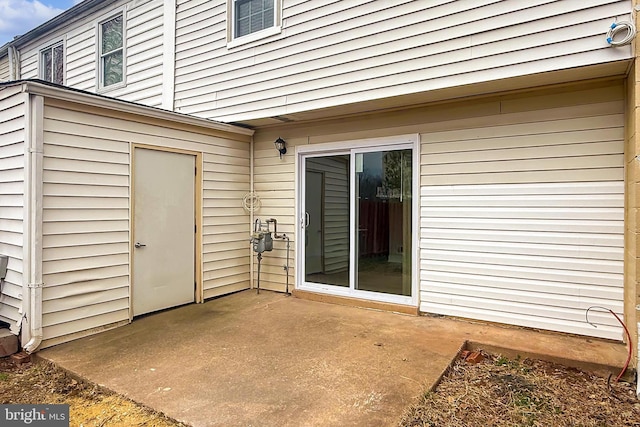 doorway to property featuring a patio area