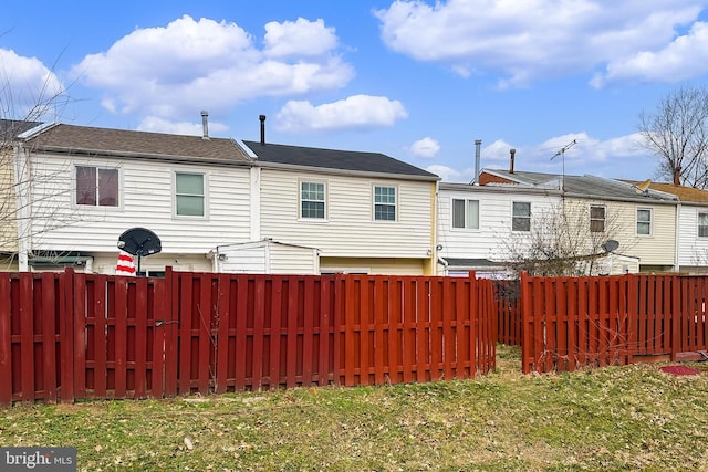 rear view of house with a yard