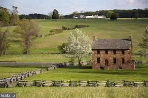 view of home's community with a yard and a rural view