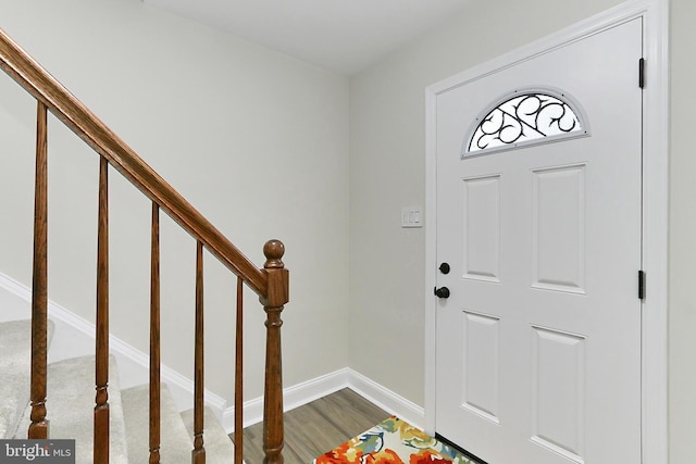 entryway with wood-type flooring