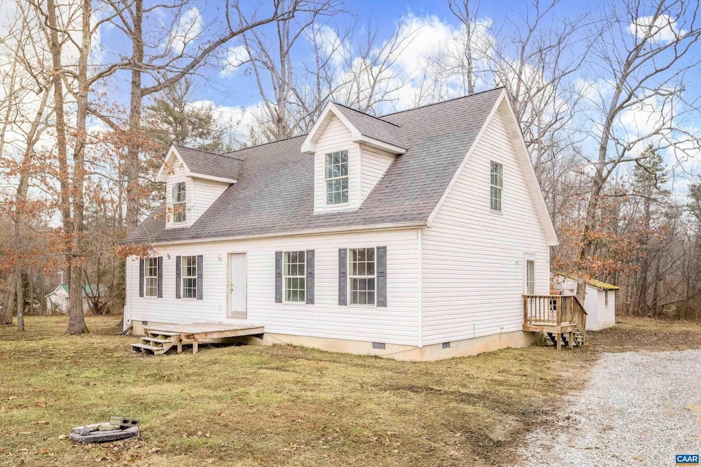 cape cod house with a front yard