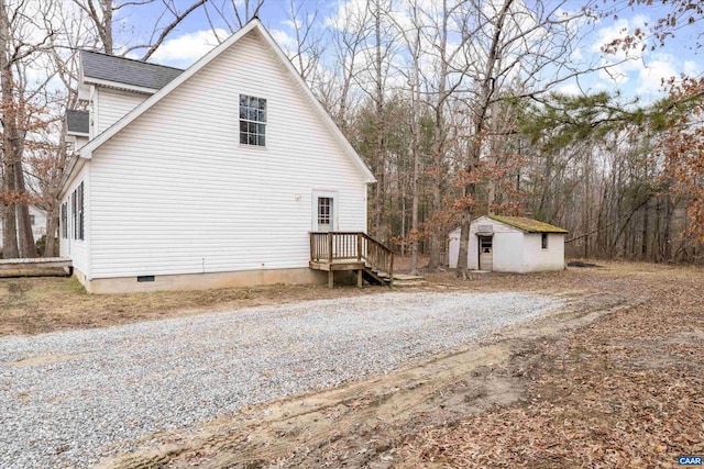 view of side of property with a storage shed