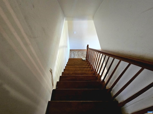 stairway featuring hardwood / wood-style floors