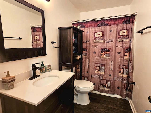 bathroom with vanity, hardwood / wood-style floors, a shower with shower curtain, and toilet