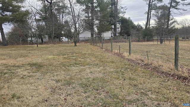 view of yard with a rural view