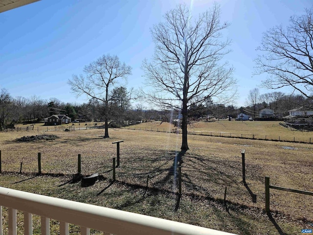 view of yard with a rural view