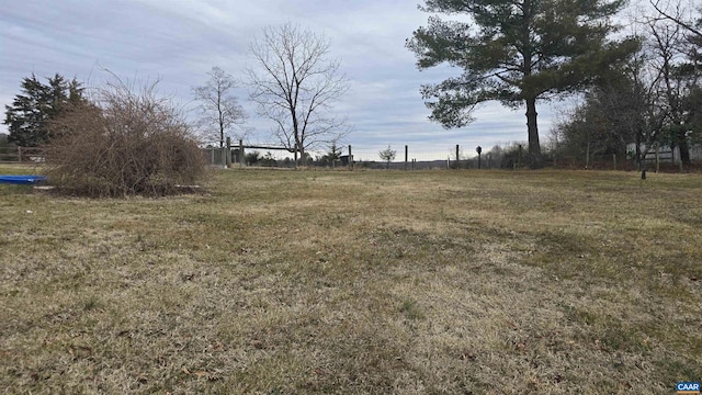 view of yard with a rural view