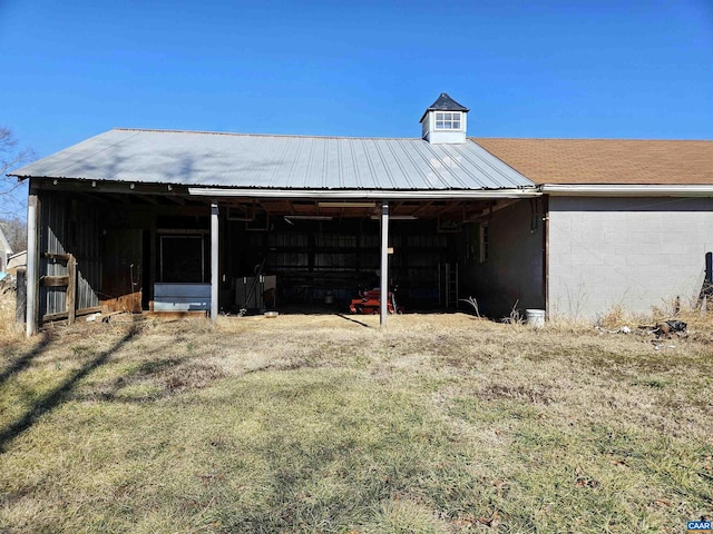 view of outdoor structure with a lawn