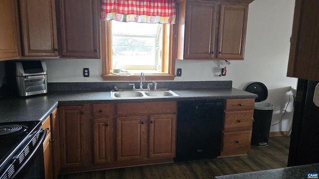 kitchen featuring dark hardwood / wood-style flooring, sink, and black appliances