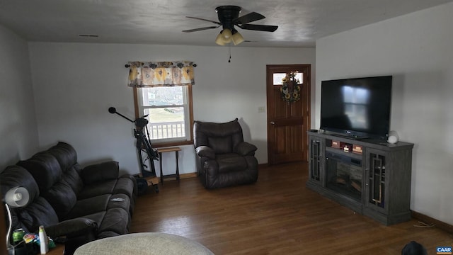 living room with hardwood / wood-style floors and ceiling fan