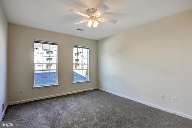 carpeted empty room with ceiling fan