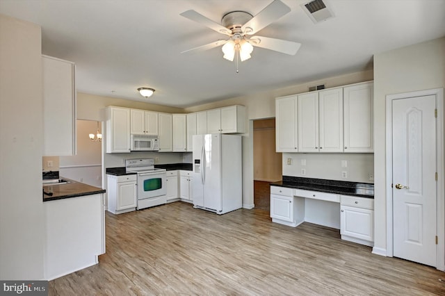 kitchen featuring white cabinetry, white appliances, built in desk, and light hardwood / wood-style floors