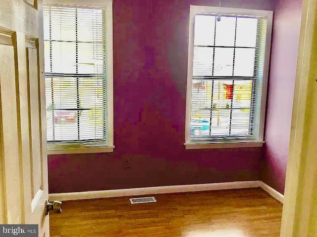 spare room featuring hardwood / wood-style flooring