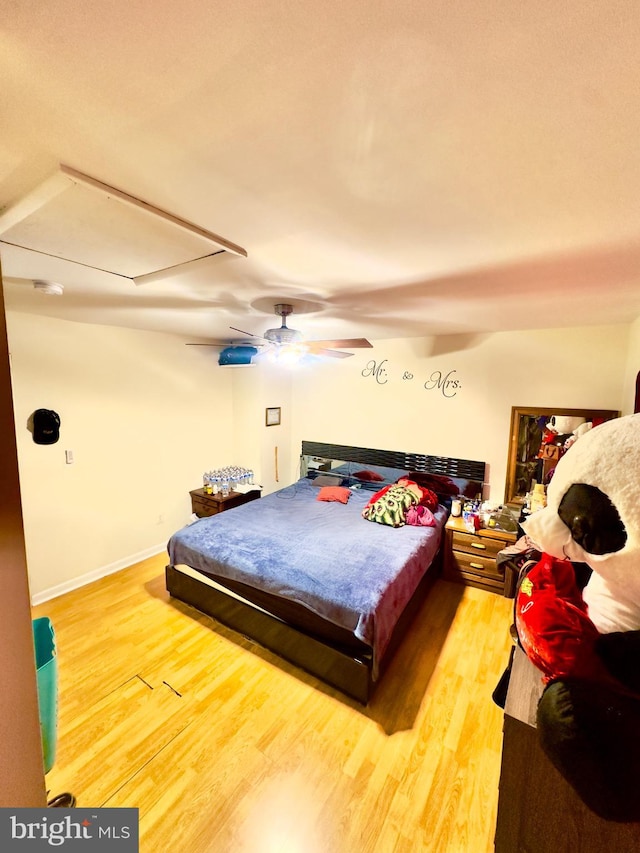 bedroom featuring wood-type flooring and ceiling fan