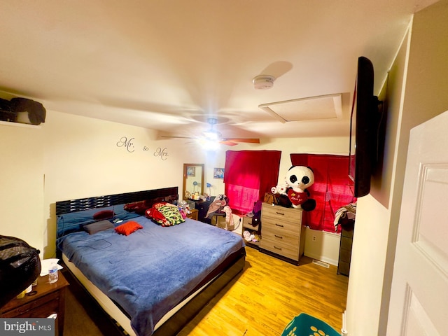 bedroom featuring hardwood / wood-style flooring and ceiling fan