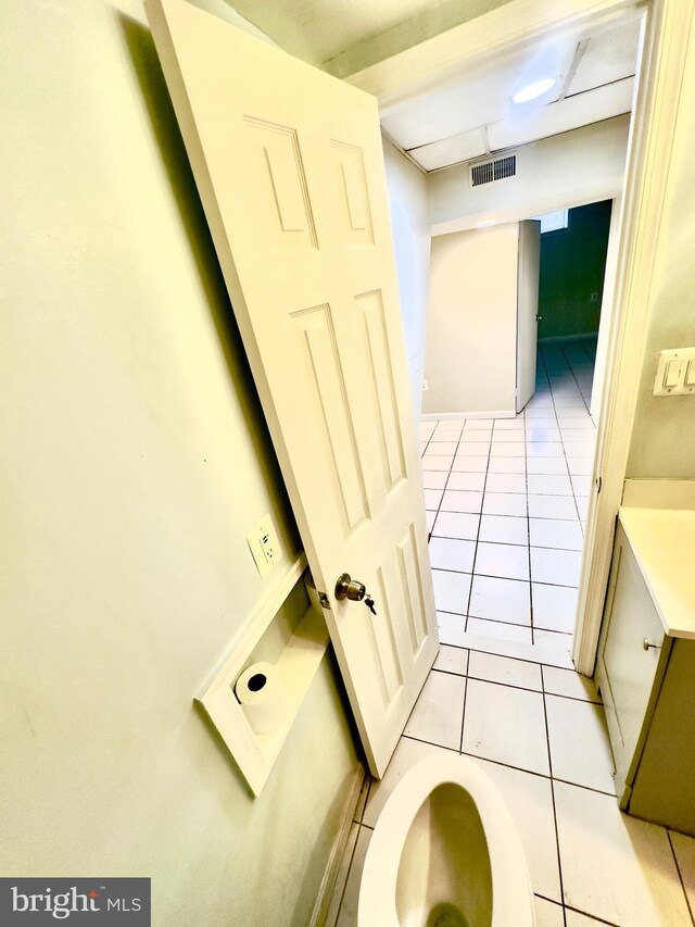 bathroom with tile patterned floors