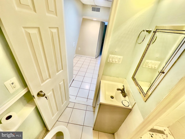 bathroom with tile patterned floors and vanity