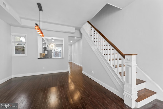 staircase featuring hardwood / wood-style floors