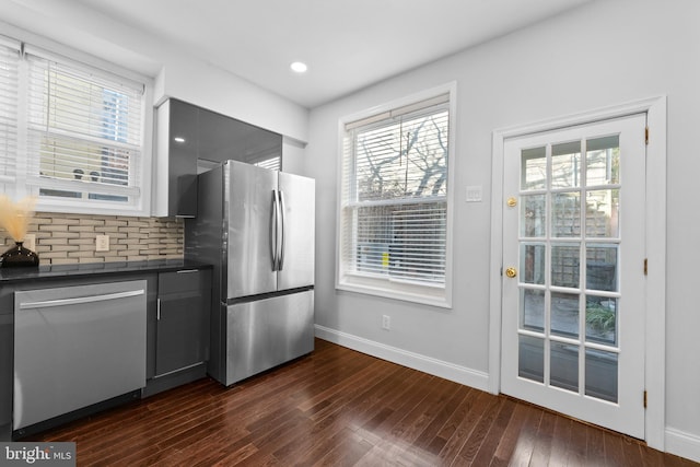 kitchen featuring dark wood-type flooring, stainless steel appliances, and gray cabinetry