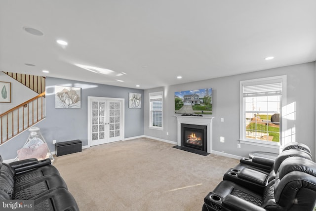 carpeted living room featuring french doors