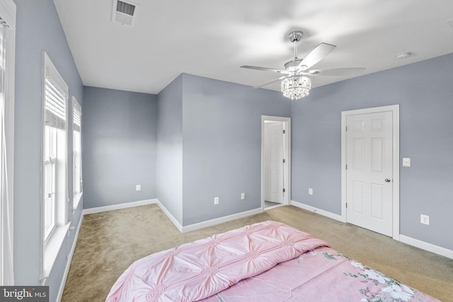 bedroom with light colored carpet and ceiling fan