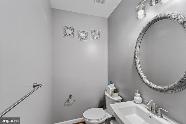 bathroom featuring sink and toilet