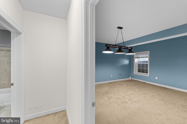 unfurnished dining area featuring carpet