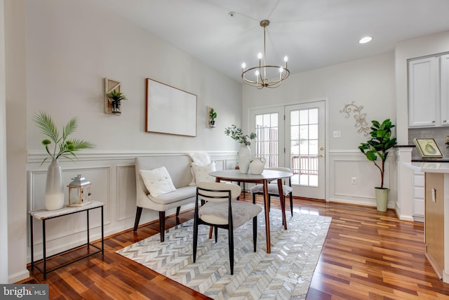 dining area with a chandelier and light wood-type flooring