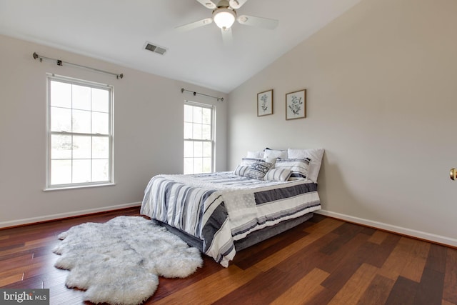 bedroom with dark wood-type flooring, ceiling fan, and vaulted ceiling