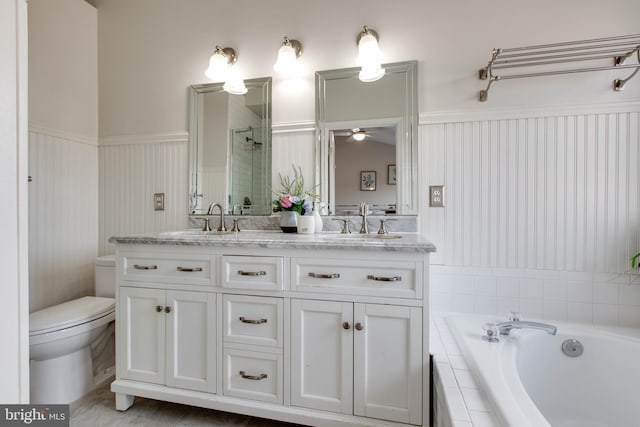 full bathroom with vanity, toilet, and independent shower and bath