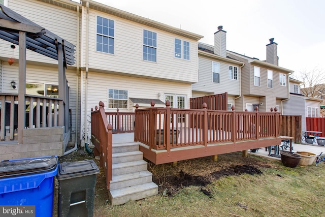 back of property with a deck