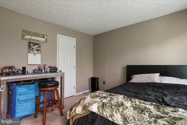 carpeted bedroom with a textured ceiling