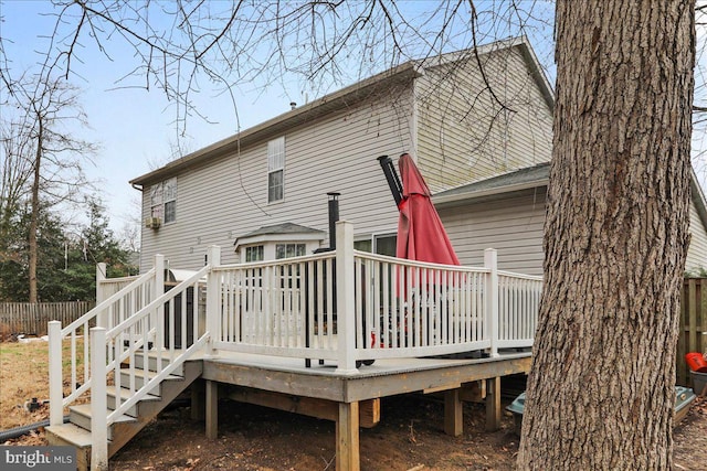 rear view of house featuring a deck