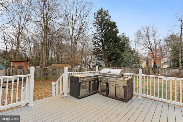 wooden deck with area for grilling