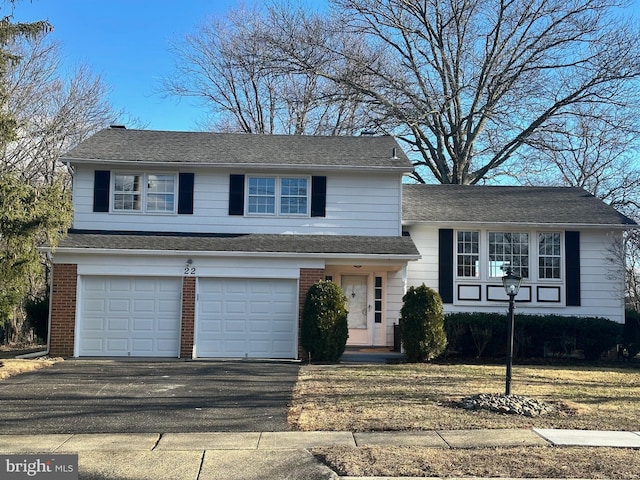 split level home featuring a garage