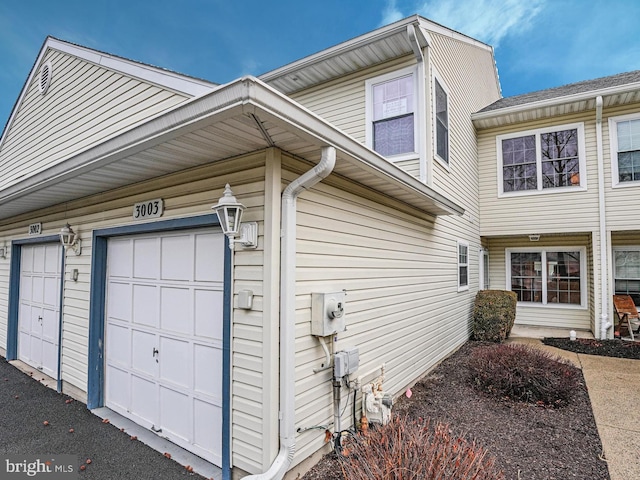 view of property exterior featuring a garage