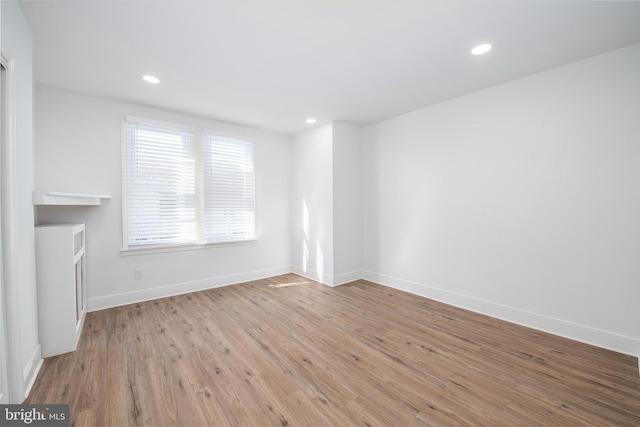 spare room featuring light hardwood / wood-style floors