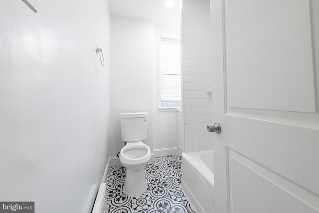 bathroom featuring tile patterned flooring and toilet